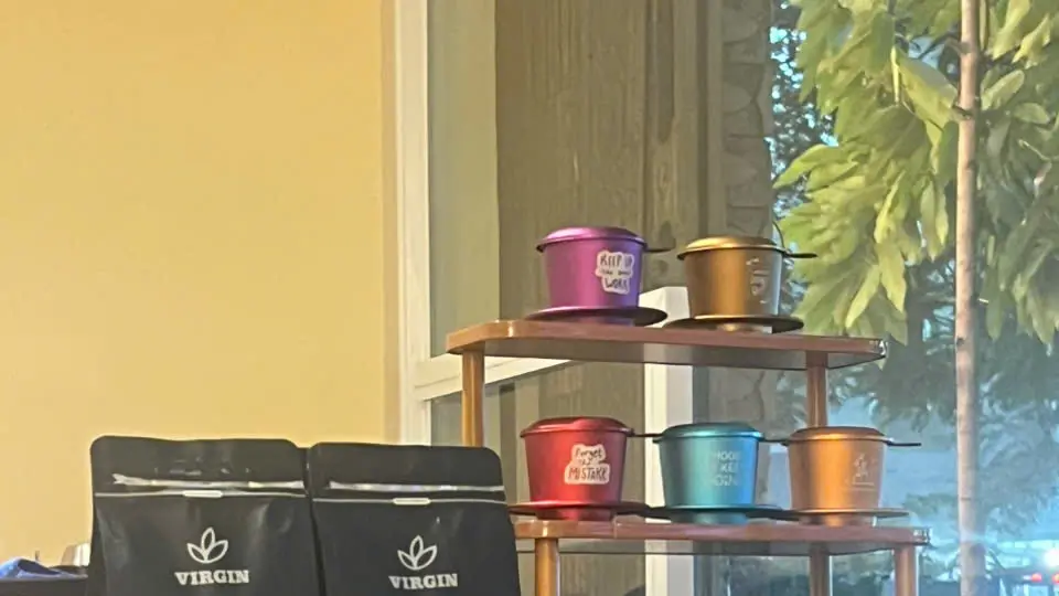 The counter at Virgin Saigon Original Coffee, 42 Nguyễn Thái Bình — where this walk starts.