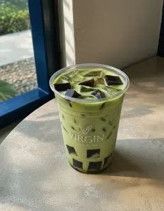 Iced matcha with coffee jelly in the Virgin cup, pale milky matcha with cubes of coffee jelly.